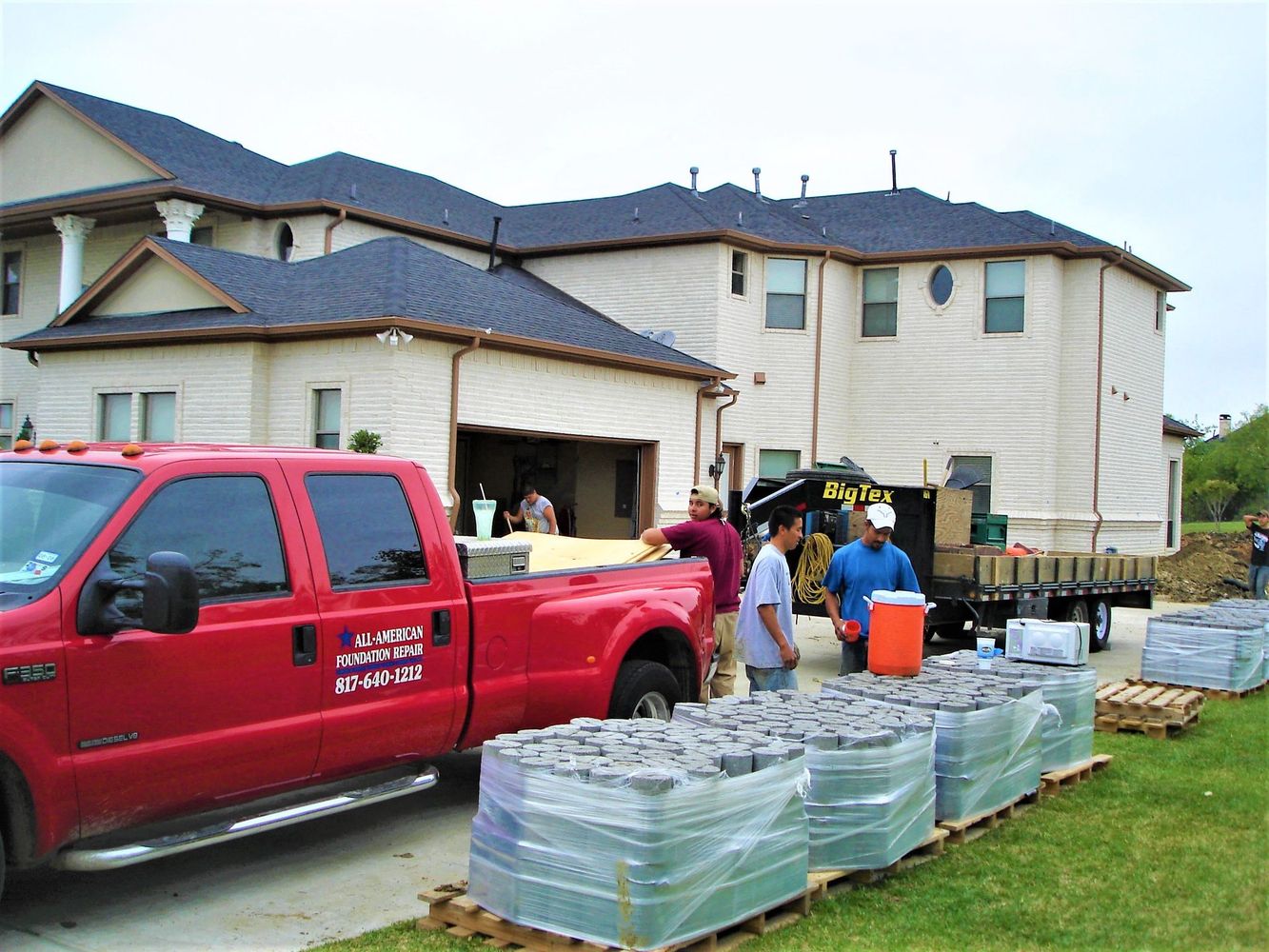Workers unloading materials at residential site