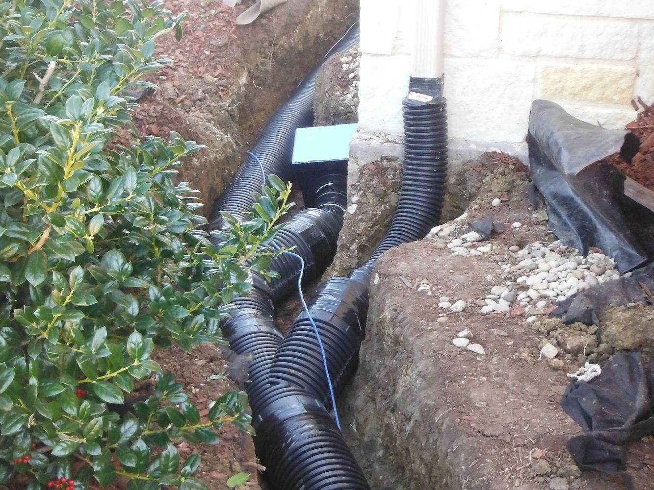 Drainage pipes in a garden trench