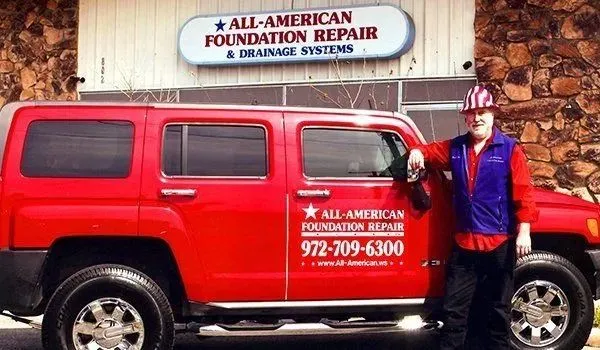 All-American Foundation Repair vehicle and building.